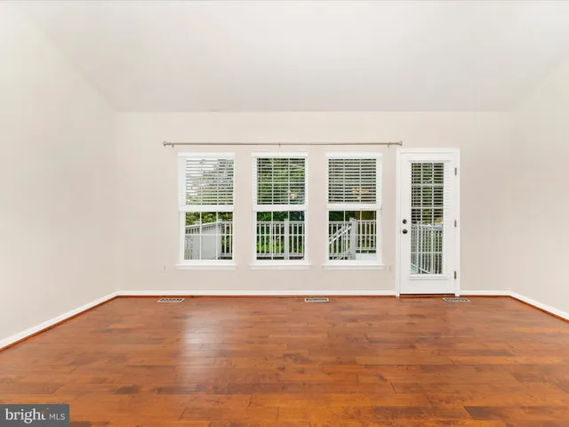 a view of kitchen with refrigerator sink and stove