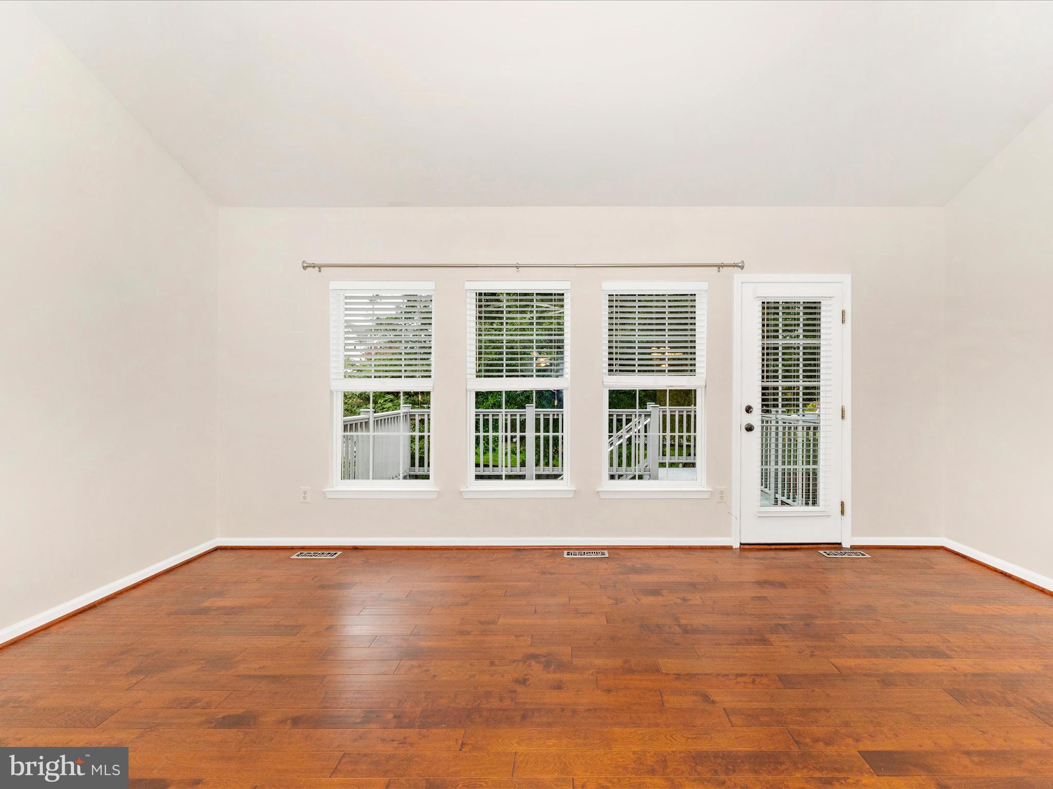 1801 Free Terrace Frederick, MD 21702 - Photo 18 of 62 a view of an empty room with wooden floor and a window