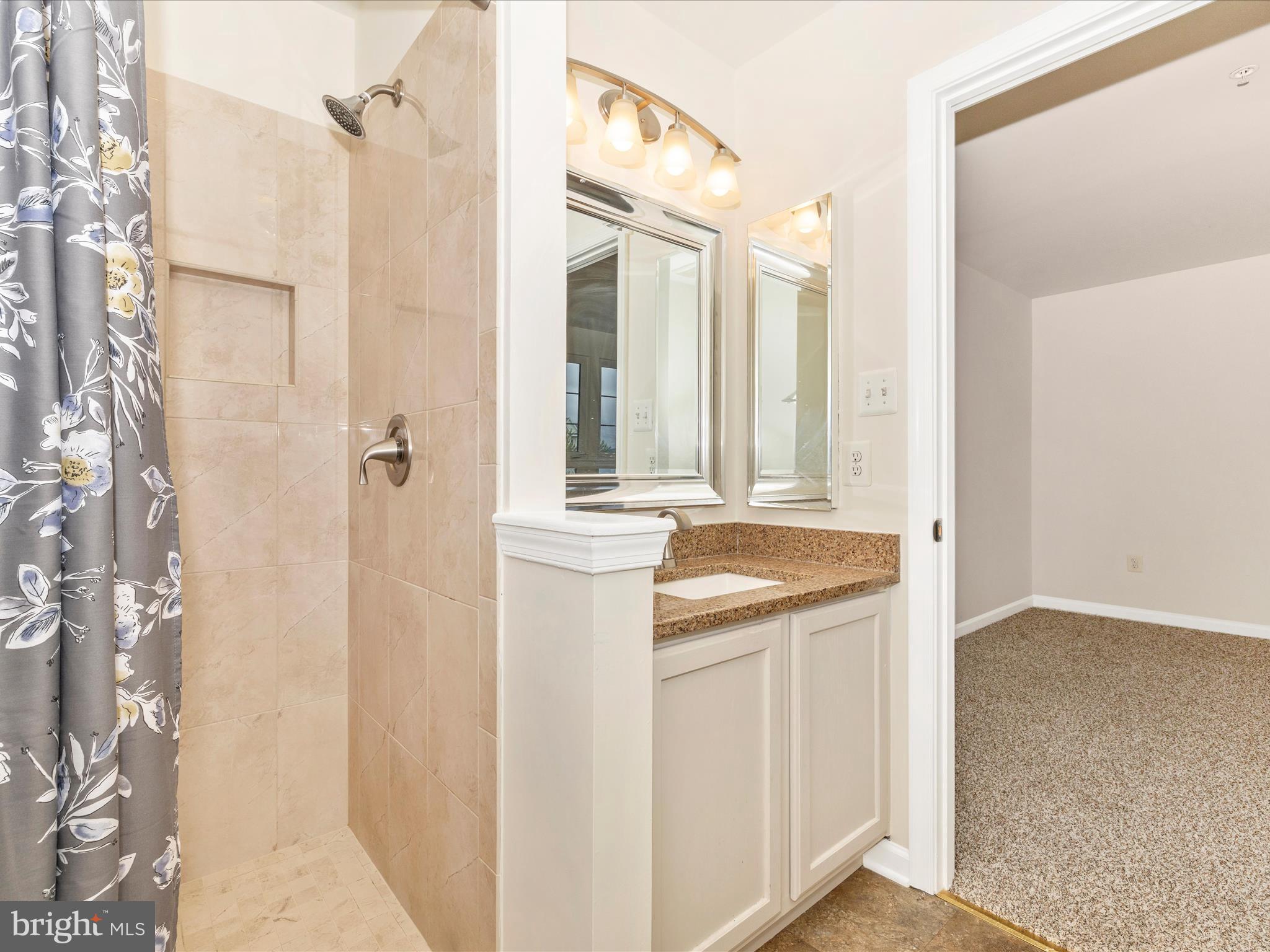 1801 Free Terrace Frederick, MD 21702 - Photo 29 of 62 a bathroom with a granite countertop sink and a mirror