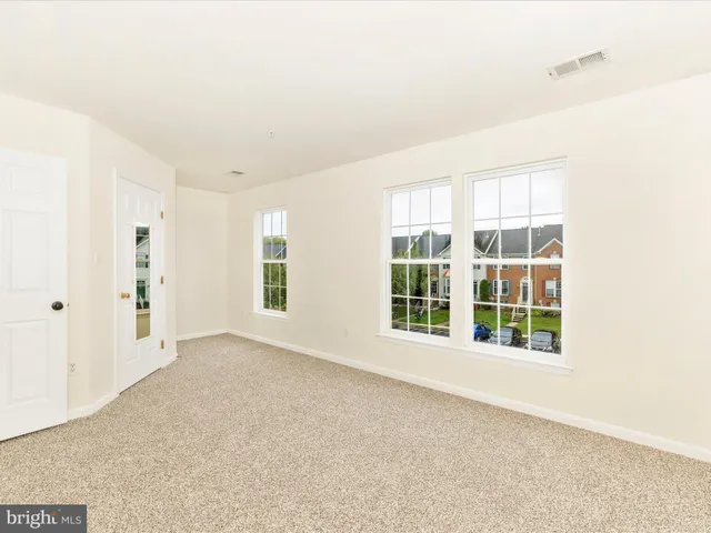 a living room with fireplace furniture and rug