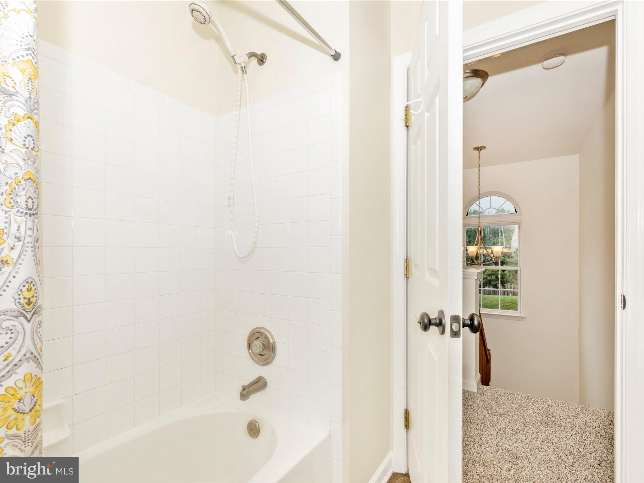 1801 Free Terrace Frederick, MD 21702 - Photo 35 of 62 a bathroom with a glass shower door