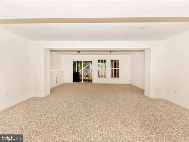 a view of a backyard with wooden fence