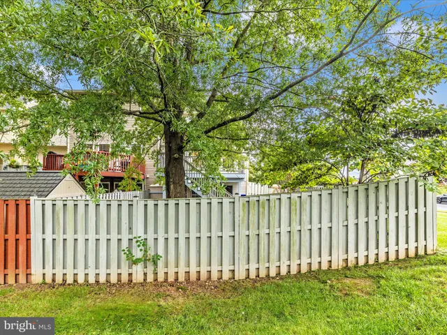 a view of a porch with a table and chairs