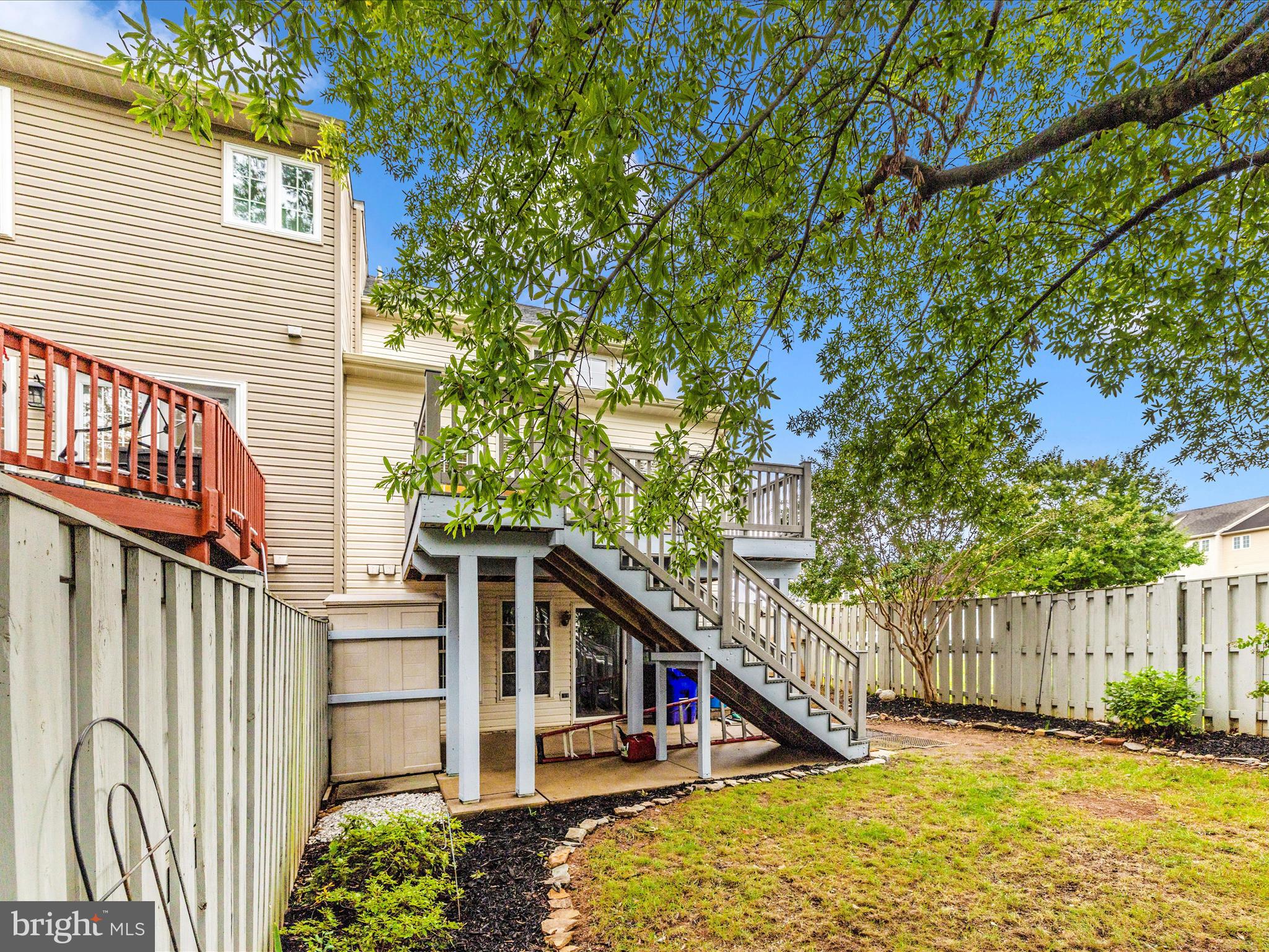 1801 Free Terrace Frederick, MD 21702 - Photo 50 of 62 a view of a house with large trees and wooden fence