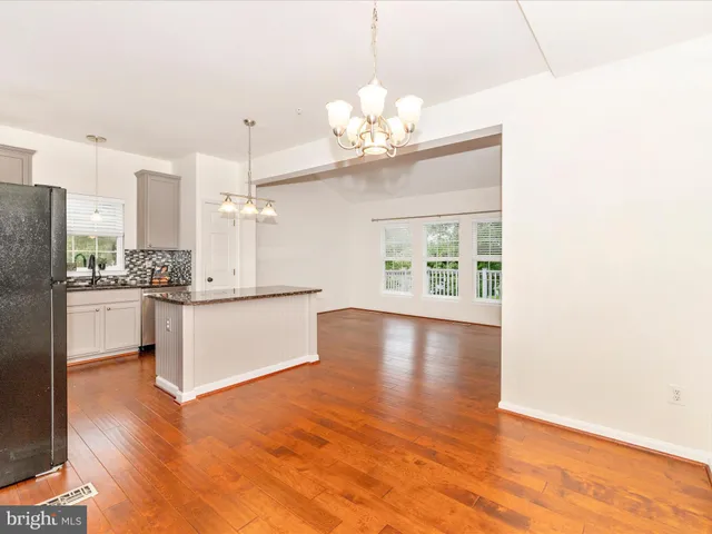 a view of a kitchen with a sink and dishwasher with kitchen view
