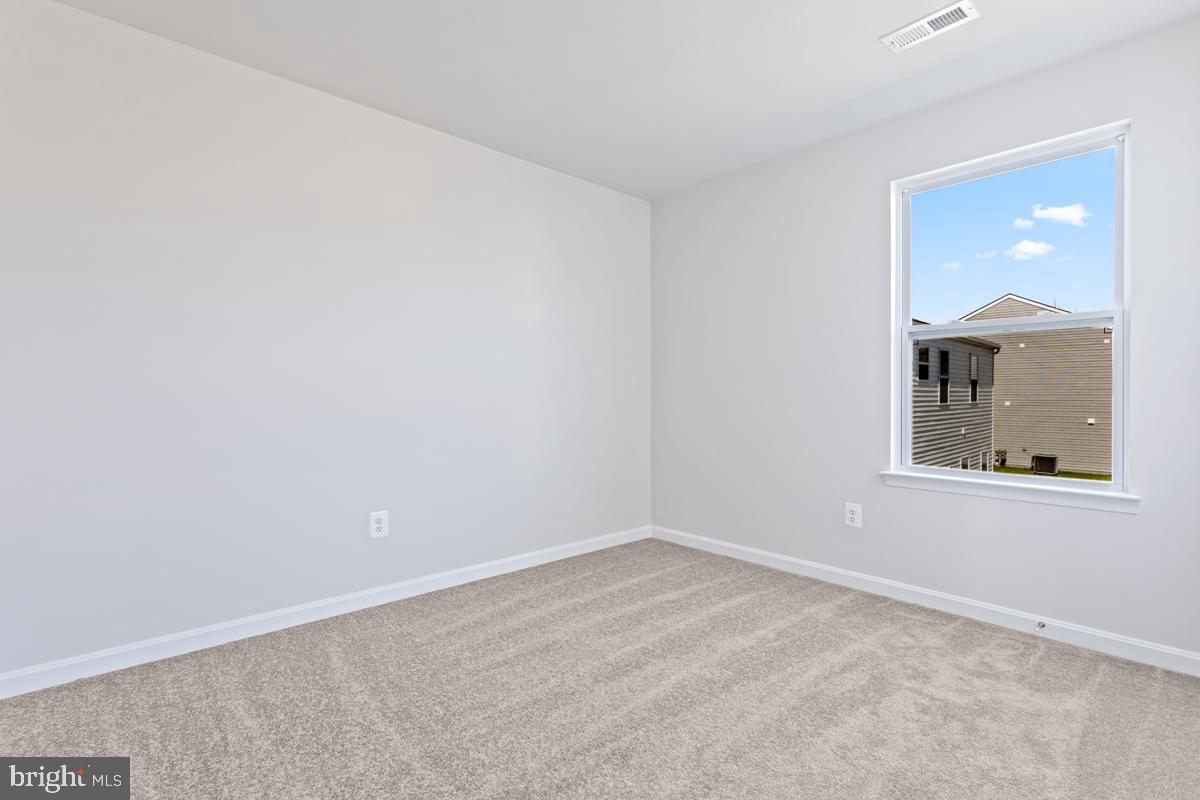 108 Ramshorn Road Inwood, WV 25428 - Photo 17 of 18 an empty room with a window