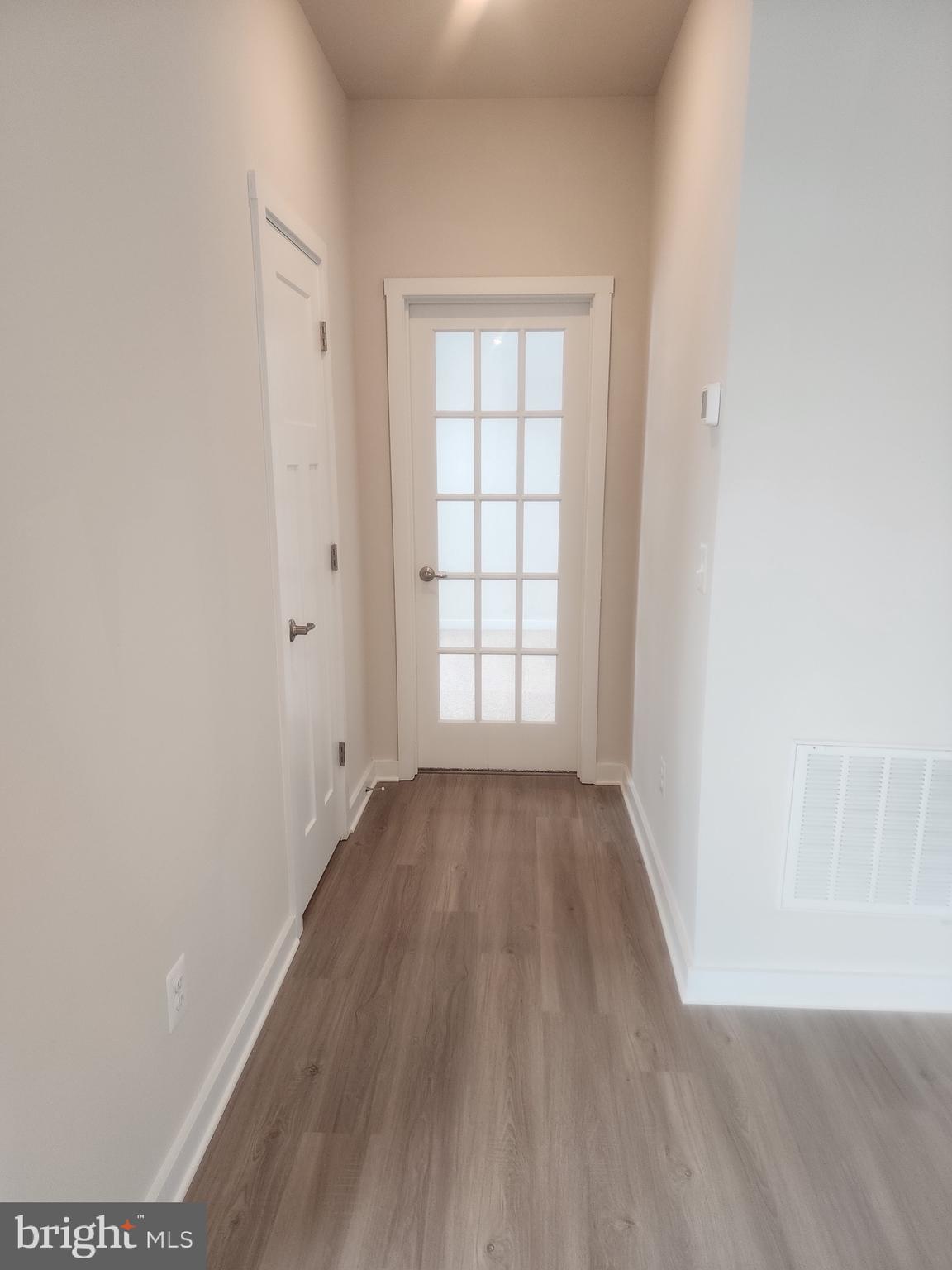 108 Ramshorn Road Inwood, WV 25428 - Photo 6 of 18 an empty room with wooden floor and windows