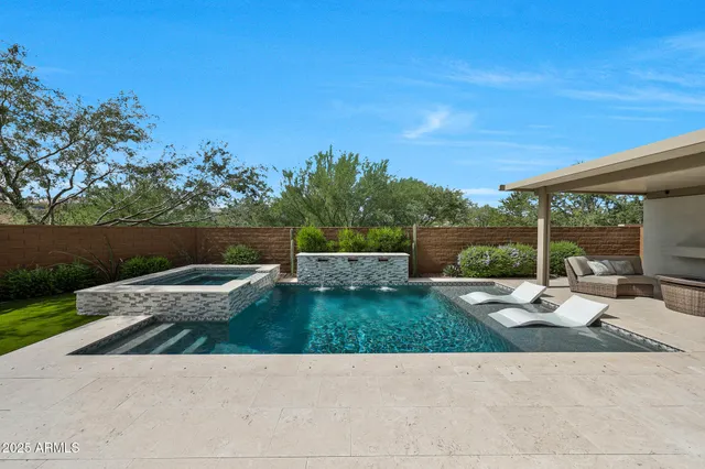 a living room with fireplace furniture and a flat screen tv
