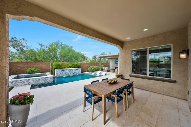 a view of a swimming pool with a lounge chairs