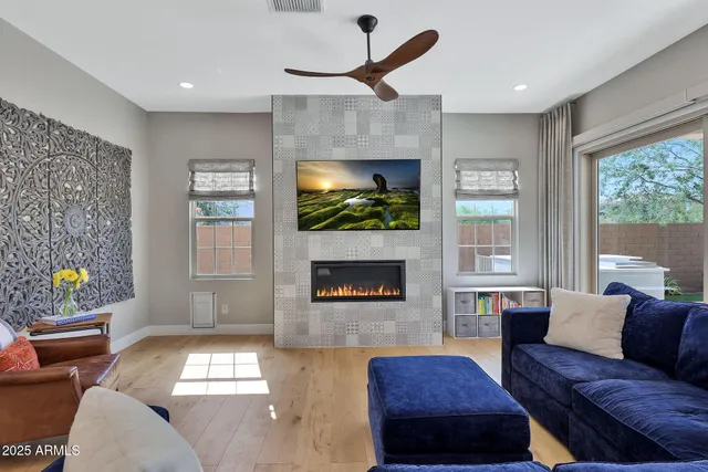 a kitchen with stainless steel appliances granite countertop a table chairs stove and refrigerator
