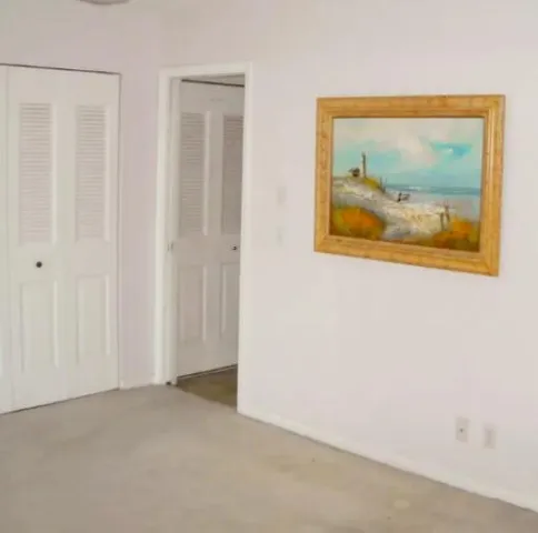 a balcony with table and chairs