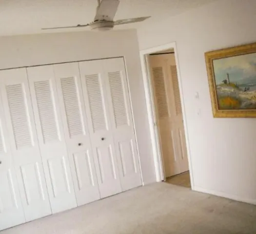 a front view of a house with a garden and plants