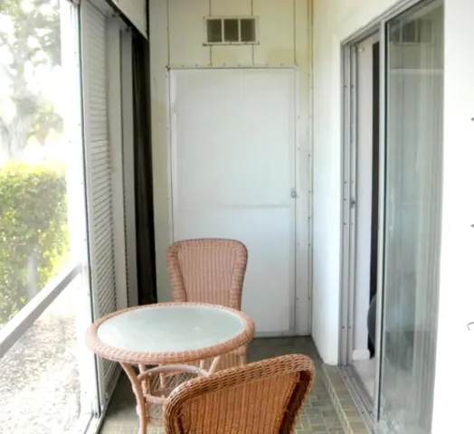 a view of a lake with houses in the back