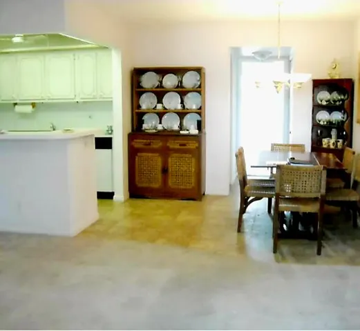 a bathroom with a toilet and a mirror