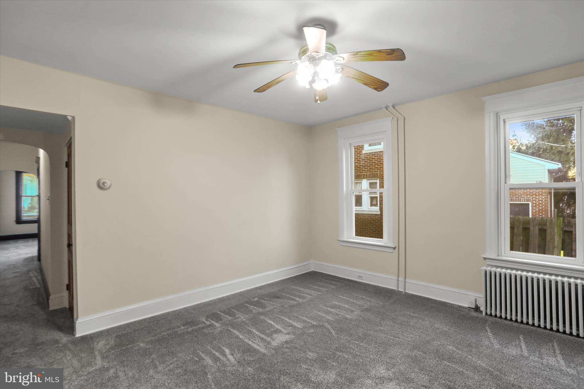 530 Baer Avenue Hanover, PA 17331 - Photo 13 of 55 an empty room with chandelier fan and windows