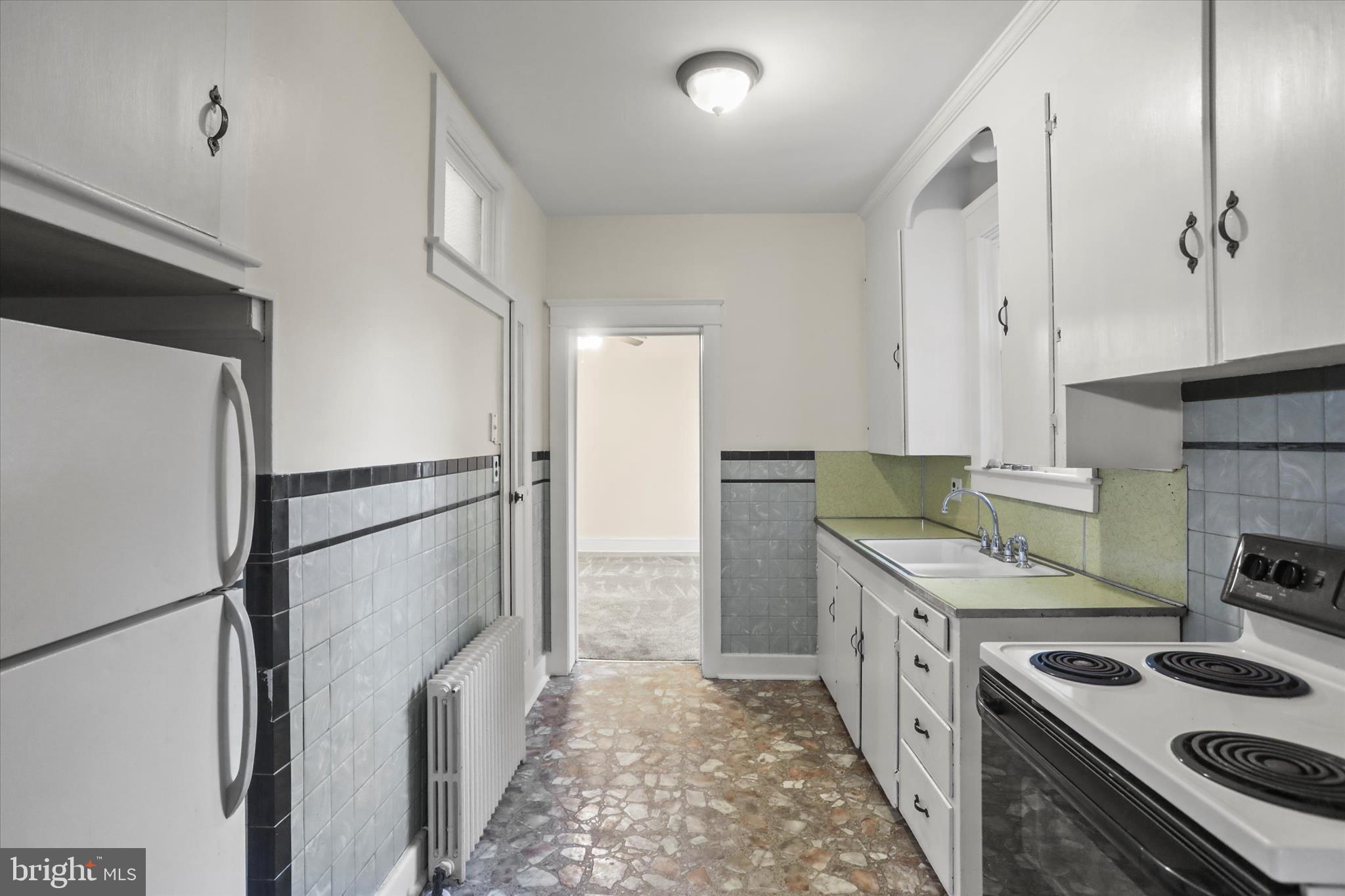 530 Baer Avenue Hanover, PA 17331 - Photo 22 of 55 a kitchen with stainless steel appliances granite countertop a refrigerator a stove and a refrigerator with white cabinets