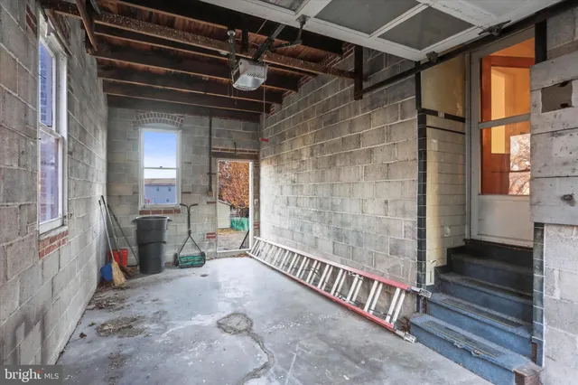 a view of an empty room with stairs