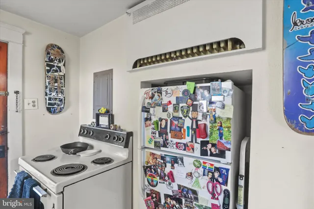 a kitchen with a sink cabinets and window