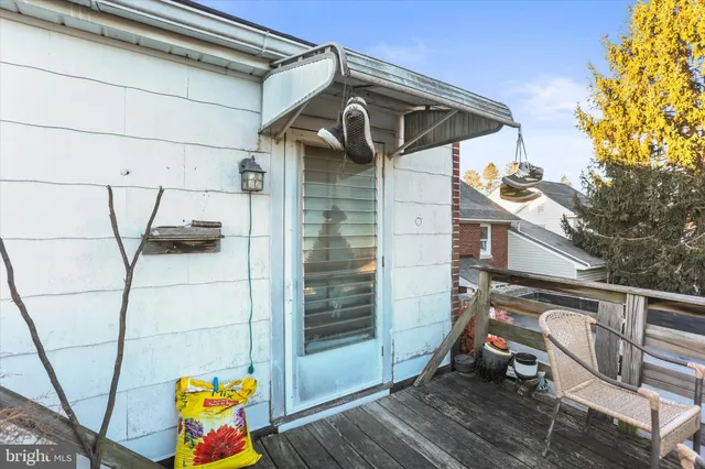 a bedroom with a bed and painting on the wall