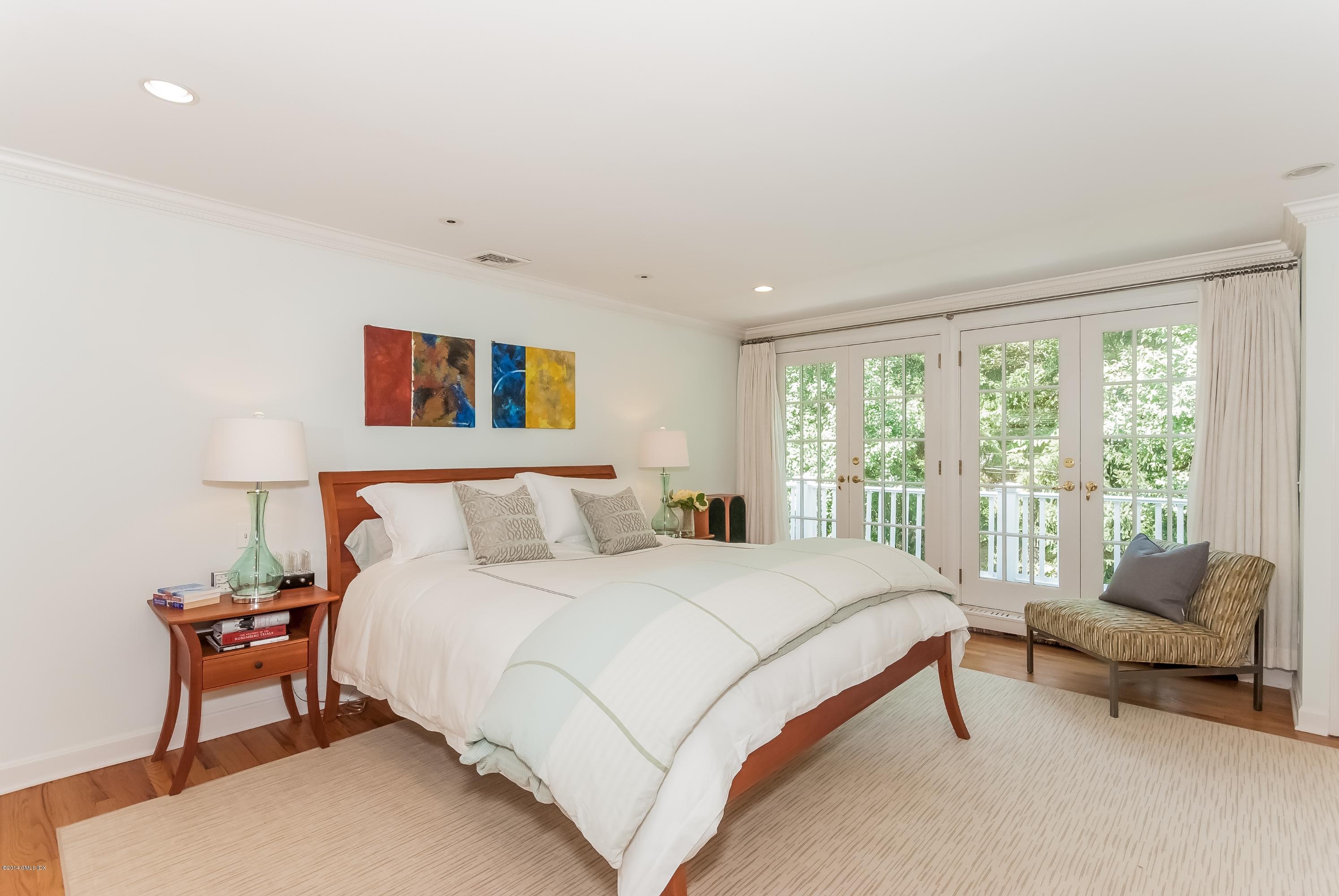 9 Willow Road Riverside, CT 06878 - Photo 9 of 21 a bedroom with a bed and a couch