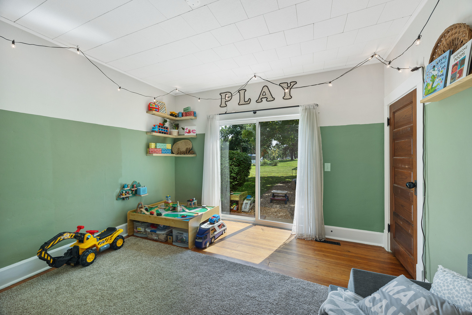 208 North East Street Lexington, IL 61753 - Photo 17 of 38 a living room with furniture and a chandelier