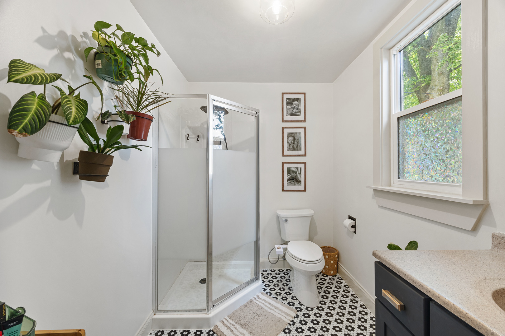 208 North East Street Lexington, IL 61753 - Photo 21 of 38 a bathroom with a granite countertop bathtub a sink and a shower