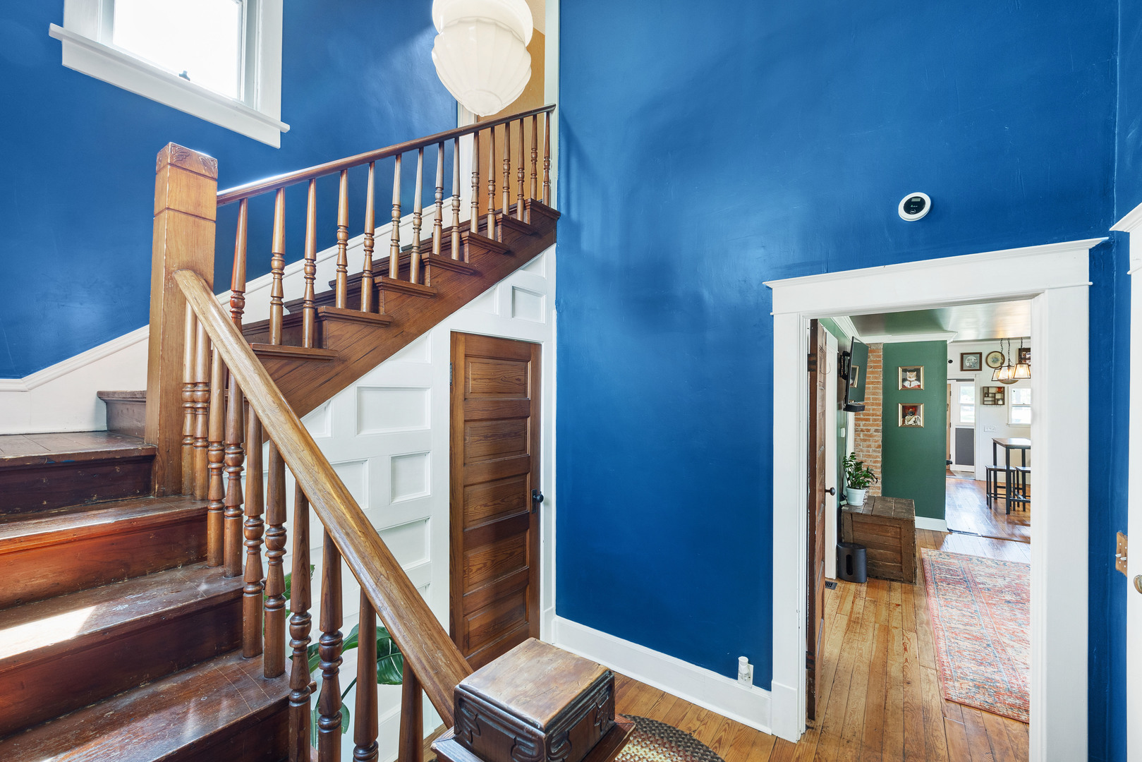 208 North East Street Lexington, IL 61753 - Photo 24 of 38 a view of a hallway with wooden floor and staircase