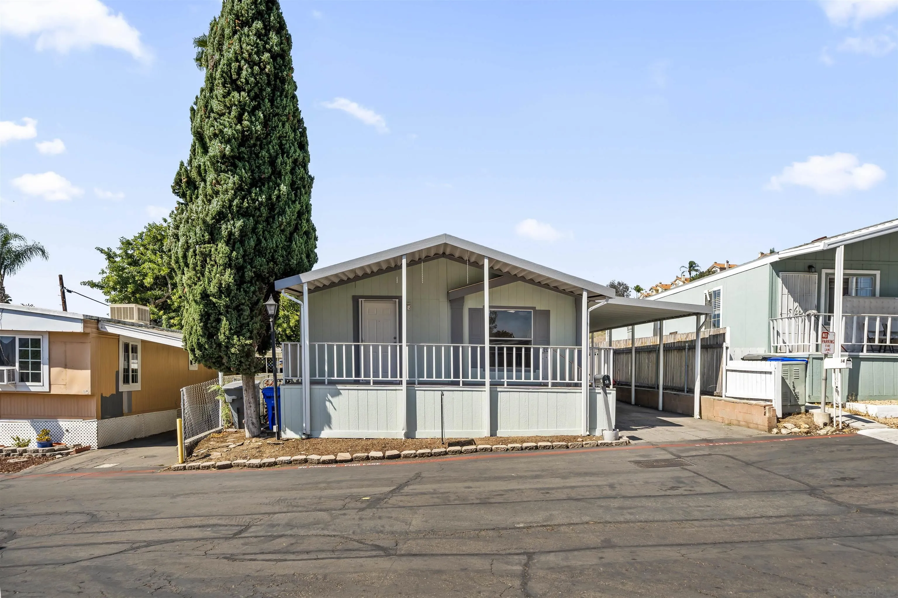 9902 Jamacha Boulevard, Unit 13 Spring Valley, CA 91977 - Photo 1 of 32 a view of a house with a yard