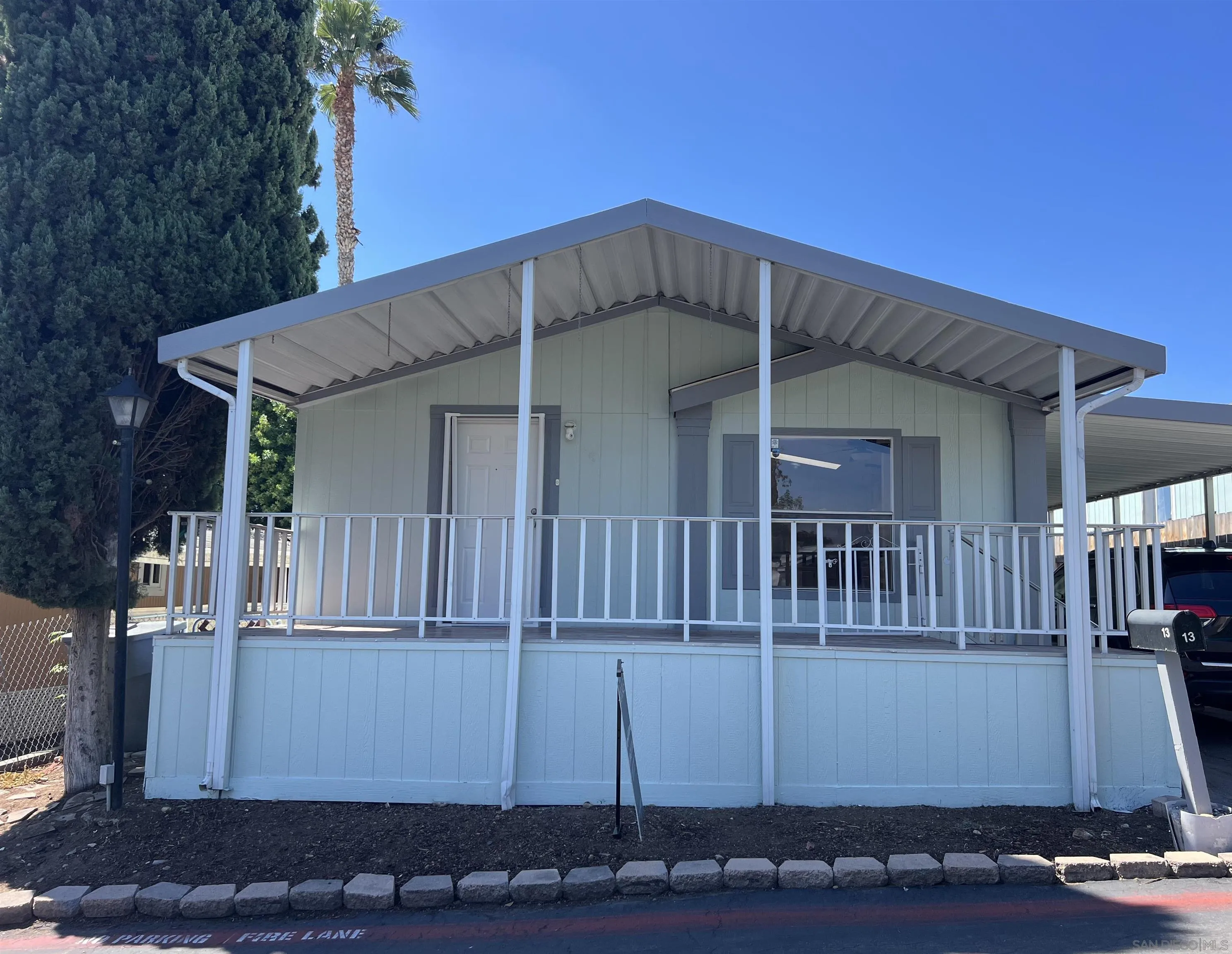 9902 Jamacha Boulevard, Unit 13 Spring Valley, CA 91977 - Photo 2 of 32 a view of a house with a garage