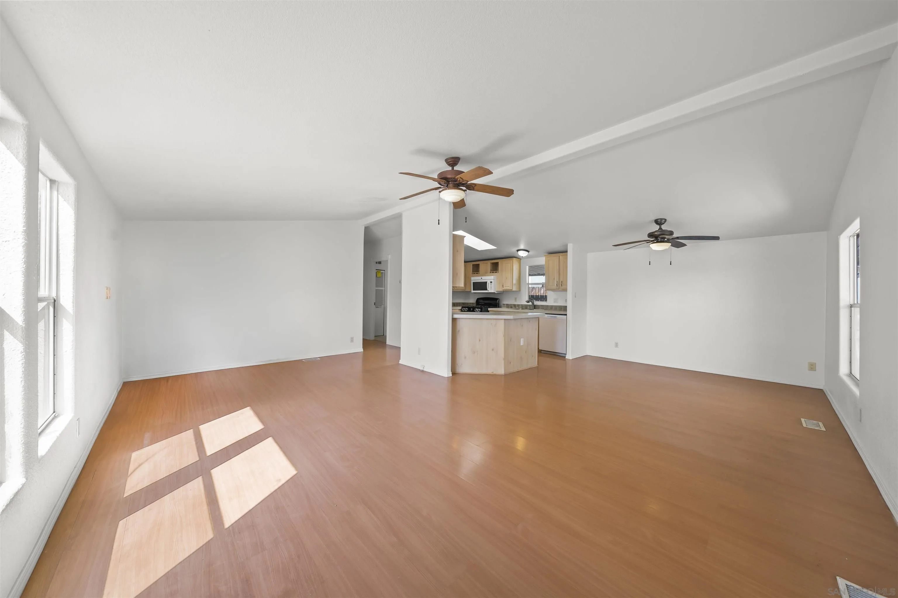9902 Jamacha Boulevard, Unit 13 Spring Valley, CA 91977 - Photo 8 of 32 wooden floor in an empty room with a window