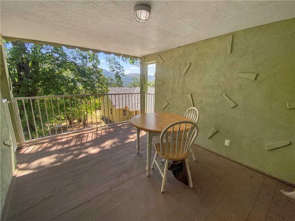 34449 Road 274 North Fork, CA 93643 - Photo 16 of 41 a view of a balcony with chair and table