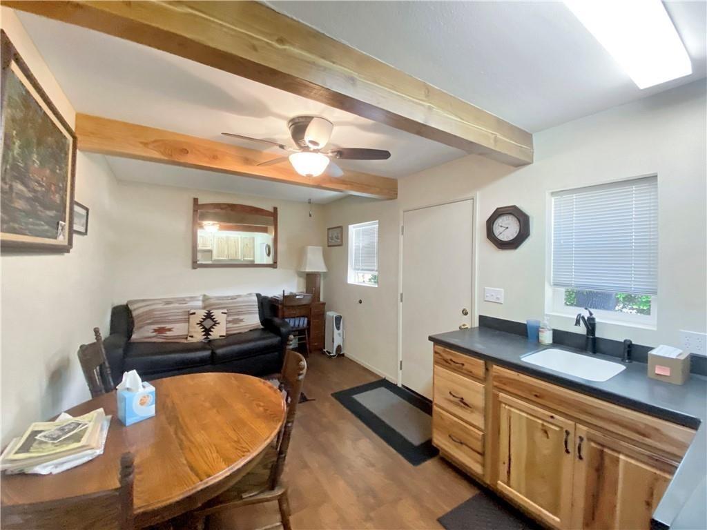34449 Road 274 North Fork, CA 93643 - Photo 17 of 41 a kitchen with a table chairs and a refrigerator