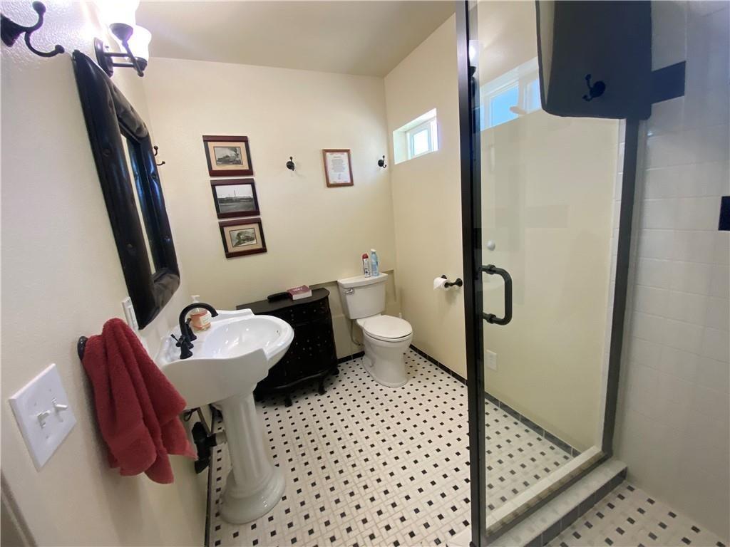 34449 Road 274 North Fork, CA 93643 - Photo 21 of 41 a bathroom with a sink toilet and shower