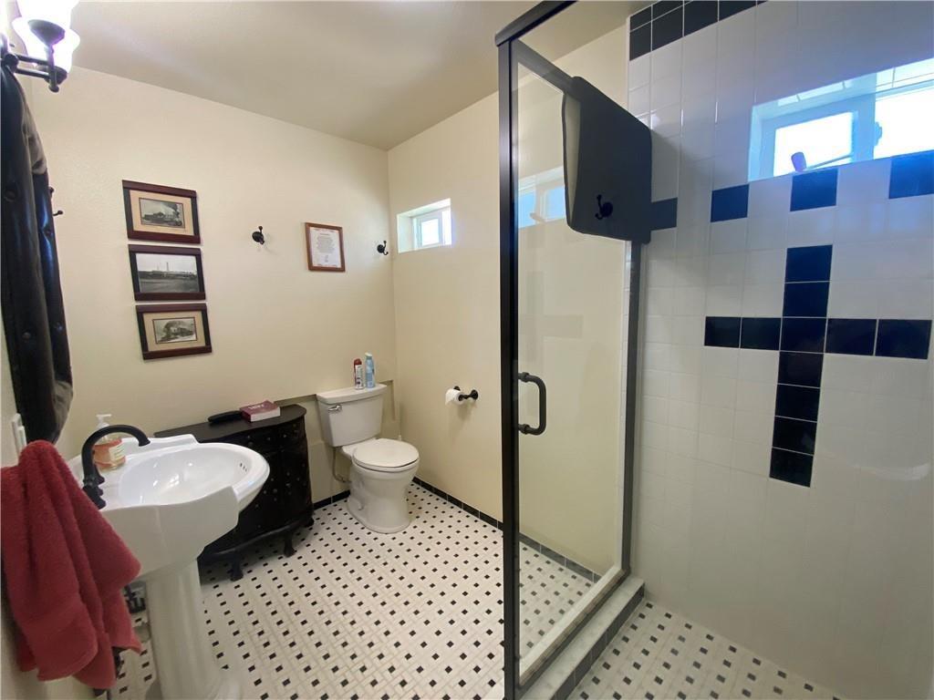 34449 Road 274 North Fork, CA 93643 - Photo 22 of 41 a bathroom with a sink toilet and shower