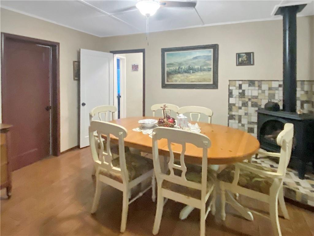 34449 Road 274 North Fork, CA 93643 - Photo 27 of 41 a dining room with furniture and wooden floor