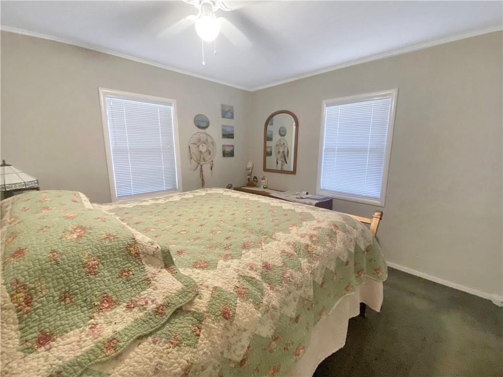 34449 Road 274 North Fork, CA 93643 - Photo 32 of 41 a bedroom with a bed and a painting on the wall