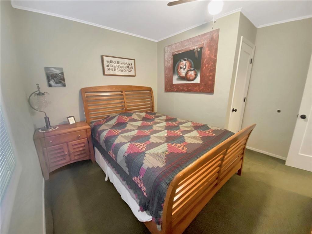 34449 Road 274 North Fork, CA 93643 - Photo 37 of 41 a bed sitting in a bedroom next to a window