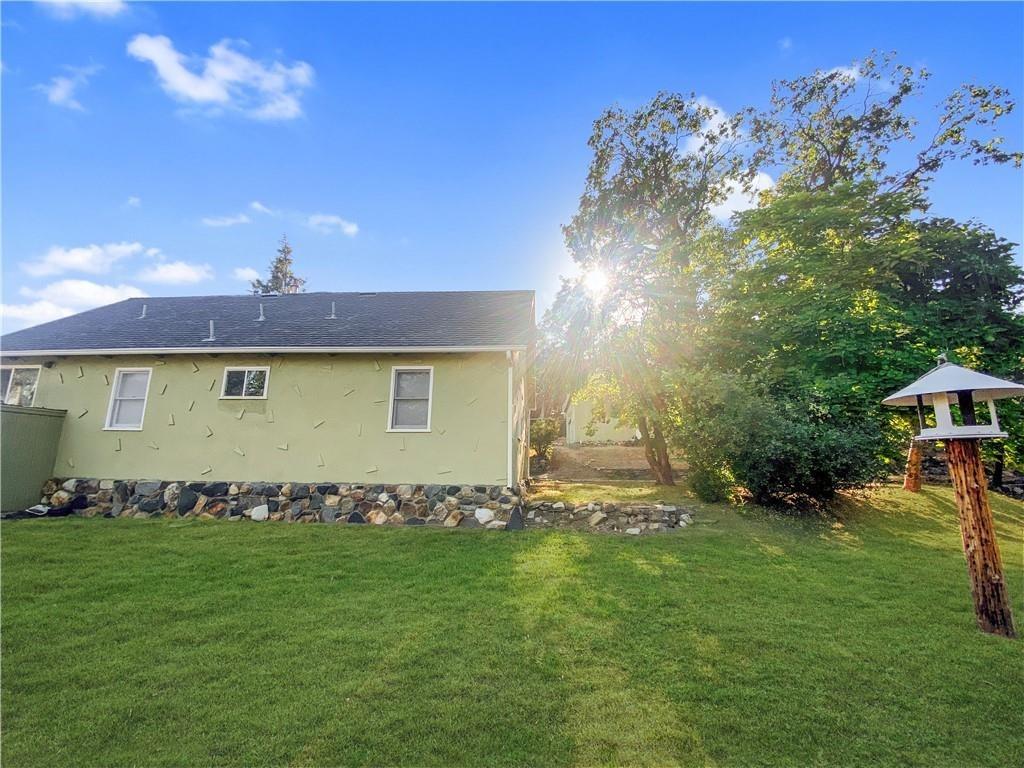 34449 Road 274 North Fork, CA 93643 - Photo 4 of 41 a front view of a house with a yard