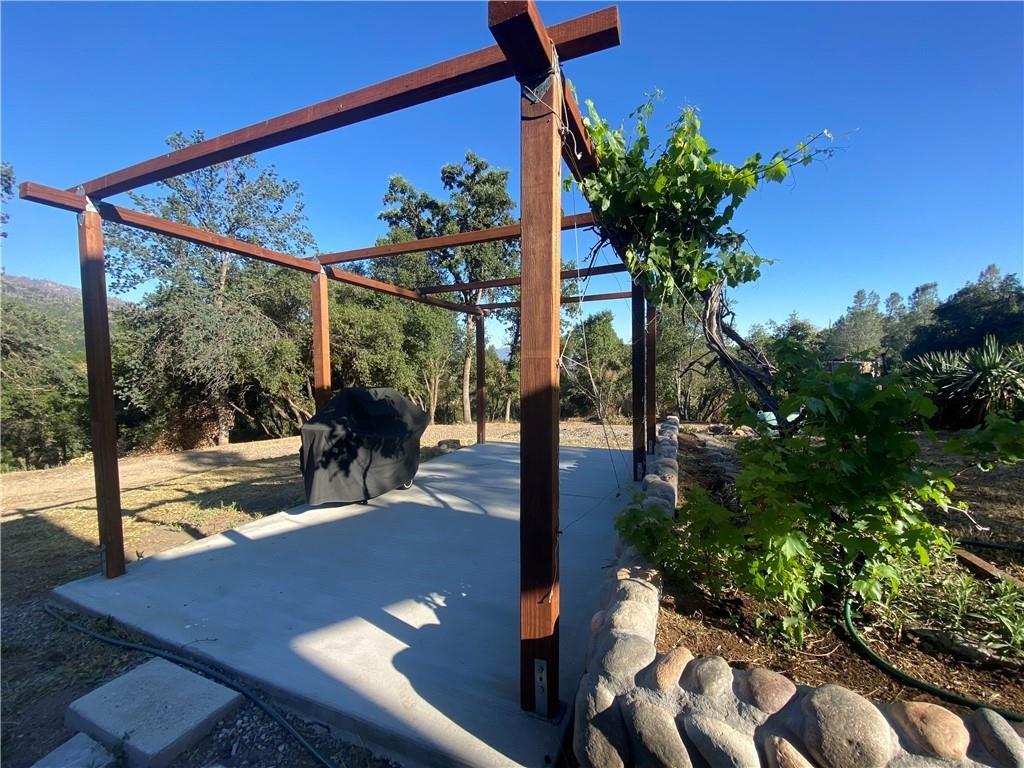 34449 Road 274 North Fork, CA 93643 - Photo 5 of 41 a view of a porch with furniture and a yard