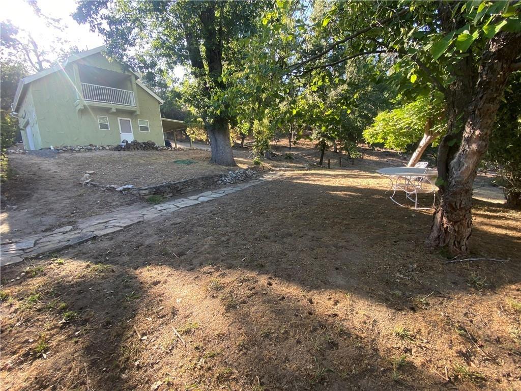 34449 Road 274 North Fork, CA 93643 - Photo 7 of 41 a view of dirt yard with a large tree