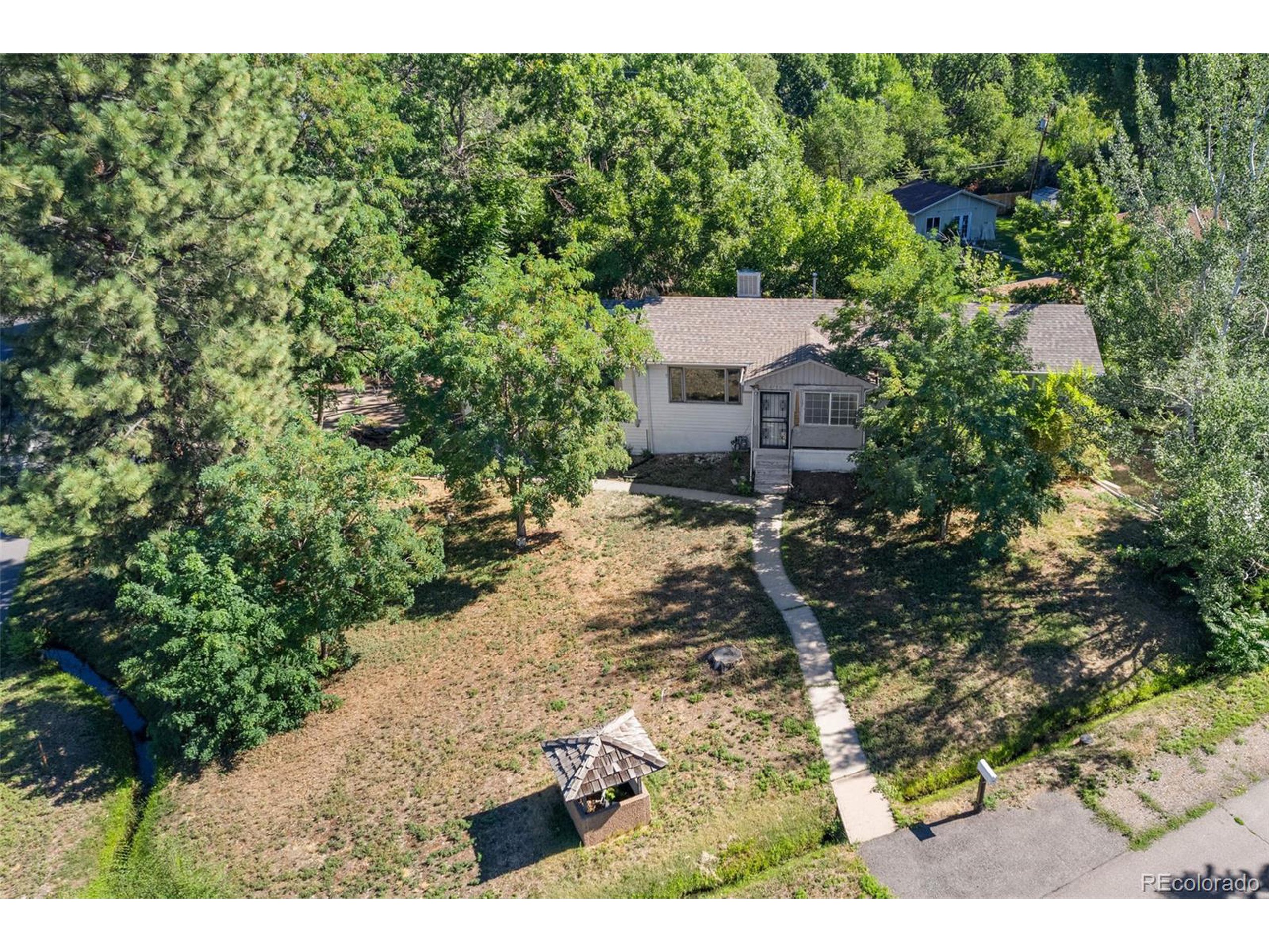 a view of house with yard