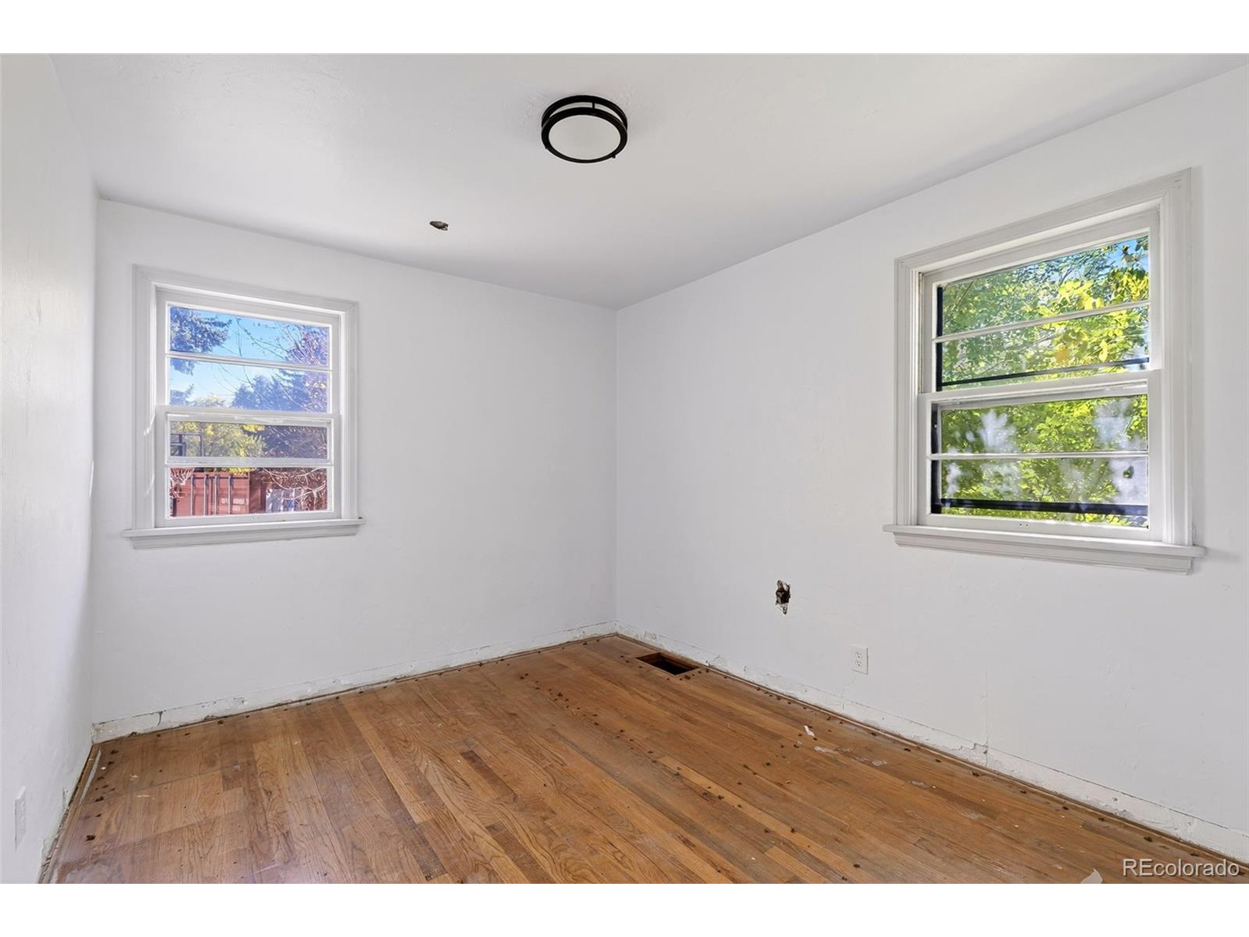 6795 West 31st Avenue Wheat Ridge, CO 80214 - Photo 9 of 35 a view of an empty room with a window