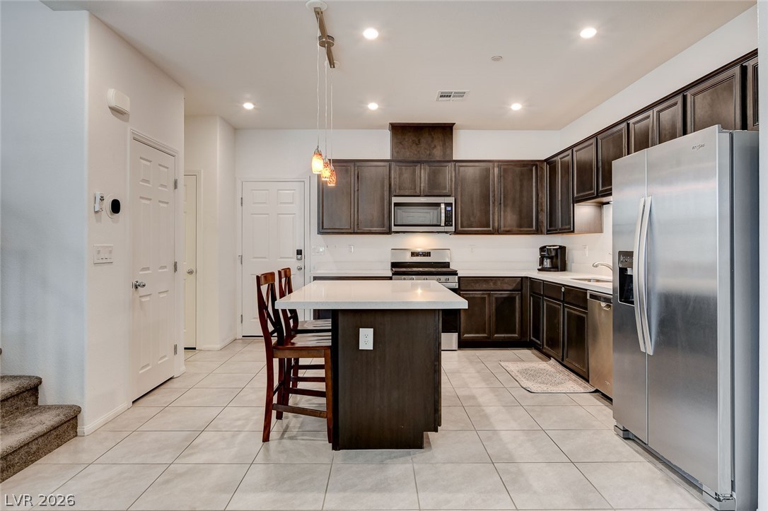 484 Filaree Place Henderson, NV 89015 - Photo 16 of 71 This spacious kitchen offers ample cabinet storage and a practical island for everyday living.
