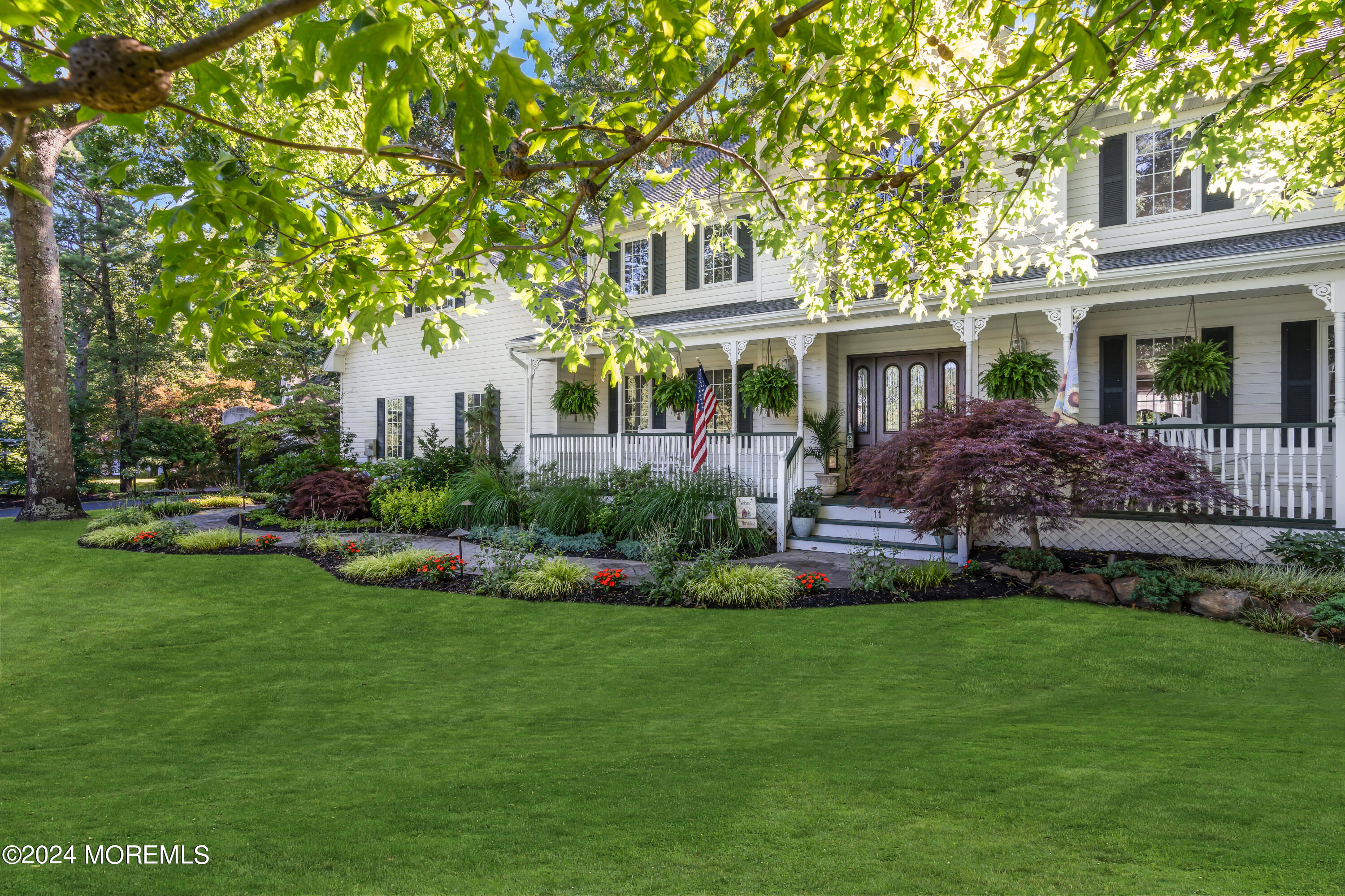 11 Dunhill Road Jackson, NJ 08527 - Photo 104 of 147 a front view of a house with a garden and patio
