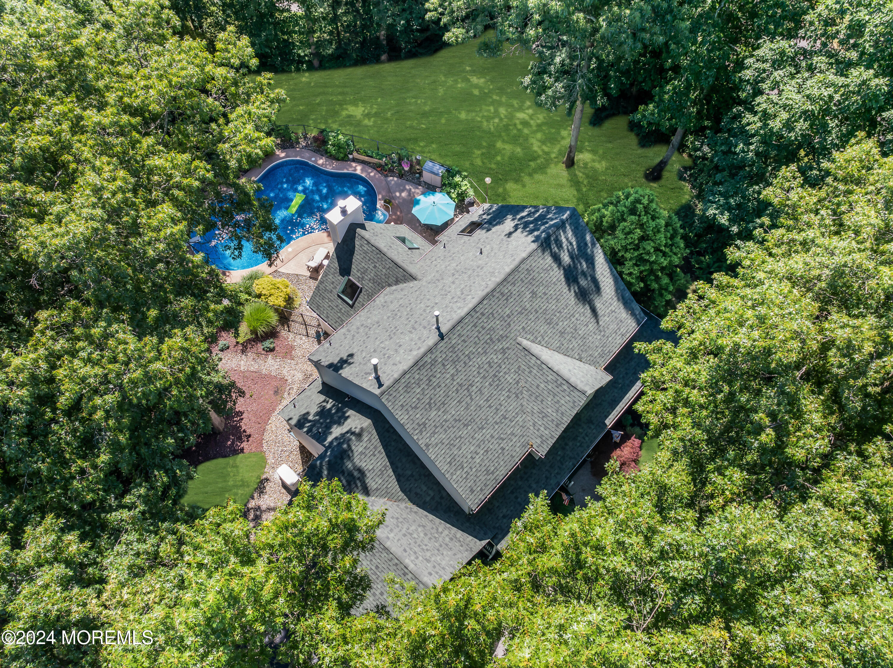 11 Dunhill Road Jackson, NJ 08527 - Photo 133 of 147 an aerial view of a house with a yard and large trees