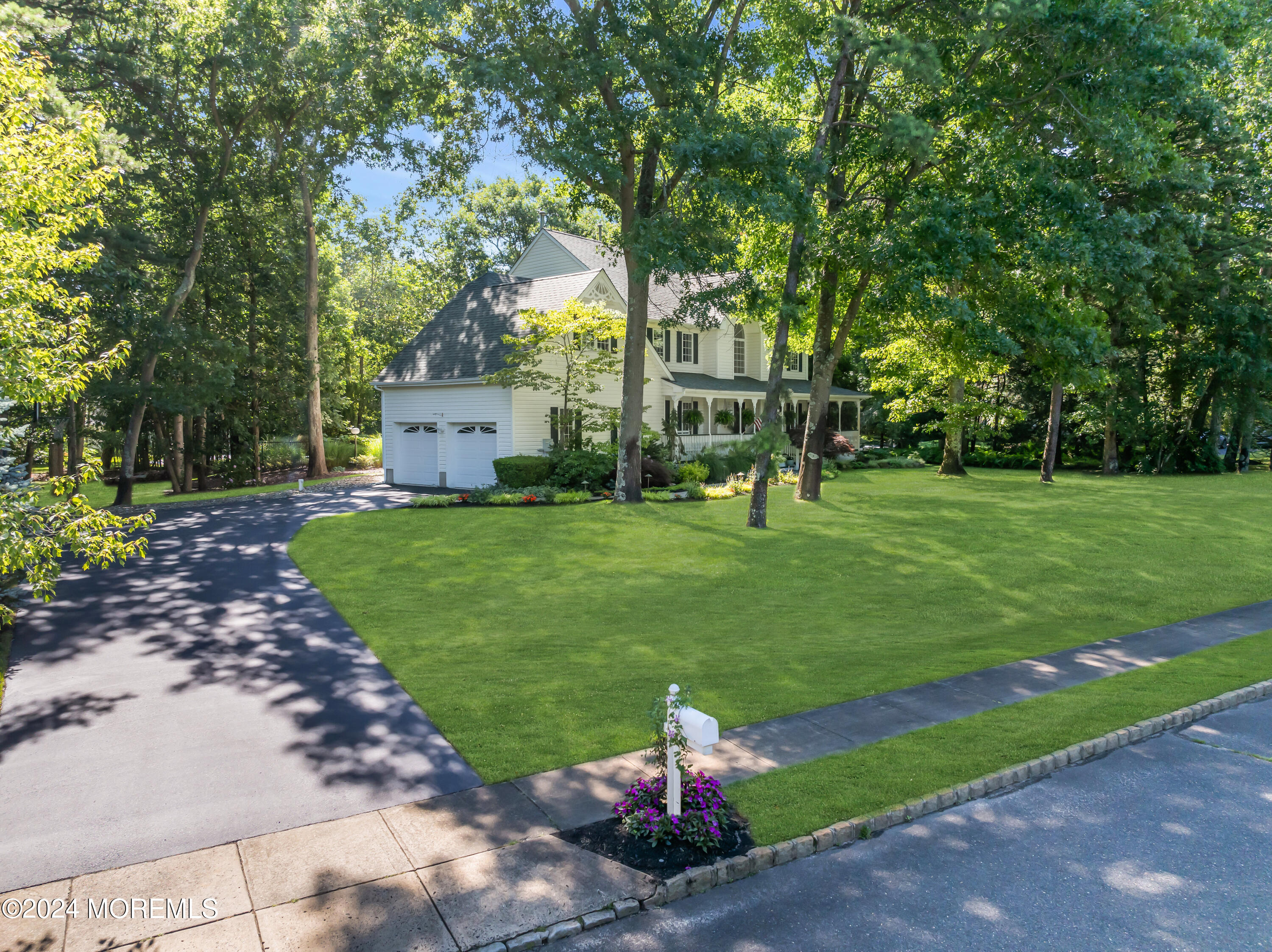 11 Dunhill Road Jackson, NJ 08527 - Photo 144 of 147 a front view of a house with a yard and trees