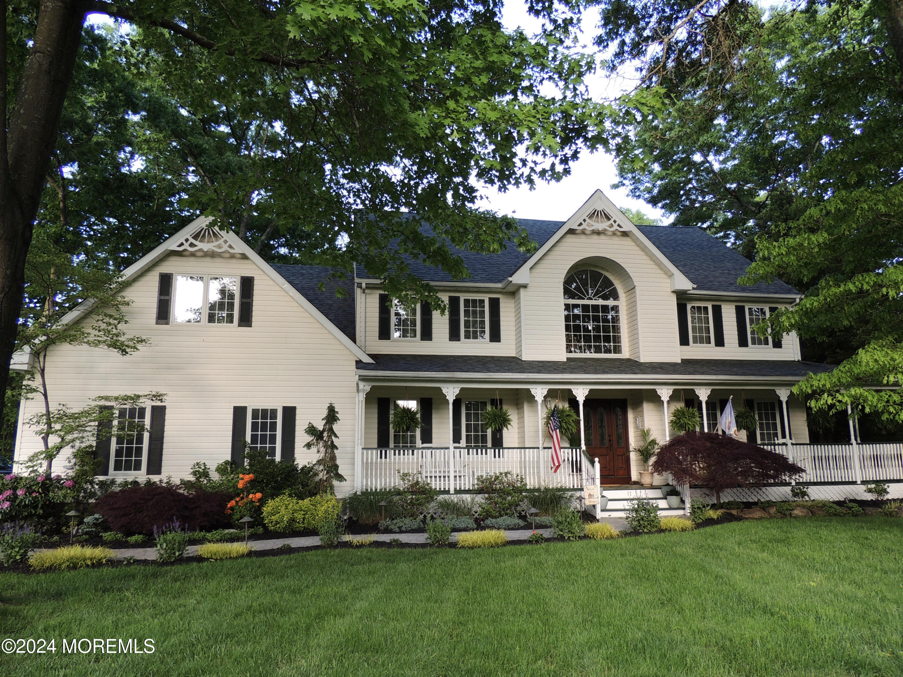 11 Dunhill Road Jackson, NJ 08527 - Photo 147 of 147 a front view of a house with a garden and trees