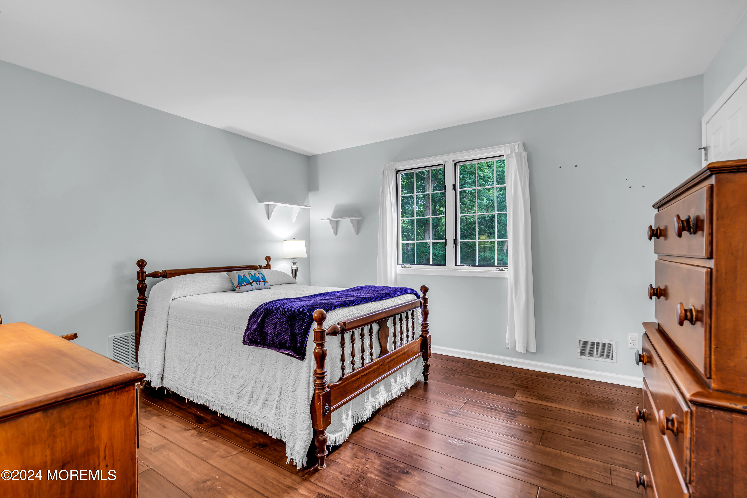 11 Dunhill Road Jackson, NJ 08527 - Photo 63 of 147 a bed sitting in a bedroom next to a window