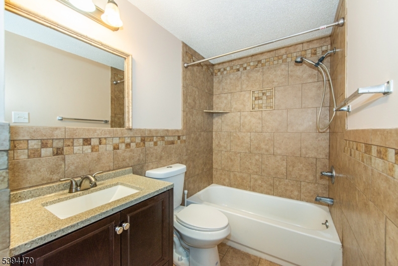 8 Constitution Way Franklin, NJ 07416 - Photo 17 of 26 a bathroom with a sink and a mirror