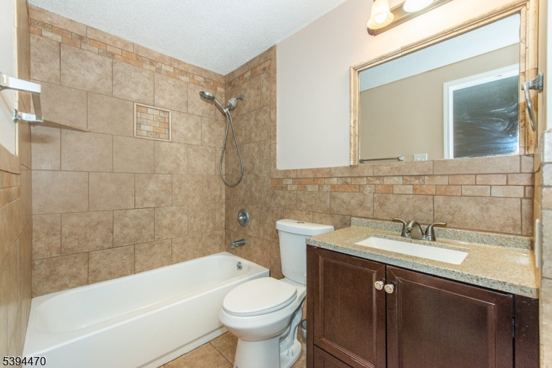 8 Constitution Way Franklin, NJ 07416 - Photo 20 of 26 a bathroom with a sink a toilet and bathtub